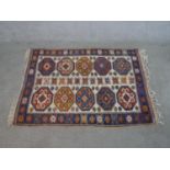 A cream ground hand made Turkish Kars rug. W.140 D.104cm