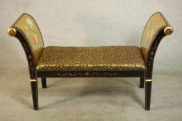 A contemporary Chinese black lacquered and parcel gilt window seat, the outspread sides gilded and