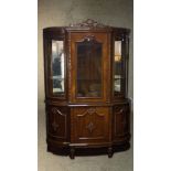 A late 20th century Louis XV style lacquered beech display cabinet, with a carved ribbon cresting