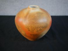 Chris Yardley, an orange glazed art pottery vase of bulbous form, signed to base. H.17cm