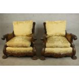 A pair of early 20th century Continental carved walnut bergere armchairs, upholstered in gold
