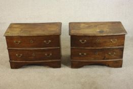 A pair of George III style bow fronted mahogany bedside chests, the top with a moulded edge over two