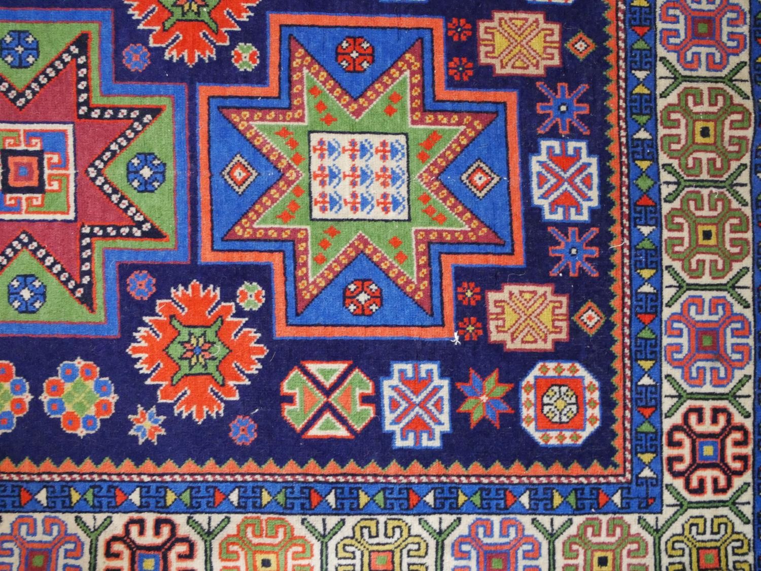 A blue ground hand made Russian Kazak rug. W.129 D.80cm - Image 3 of 6