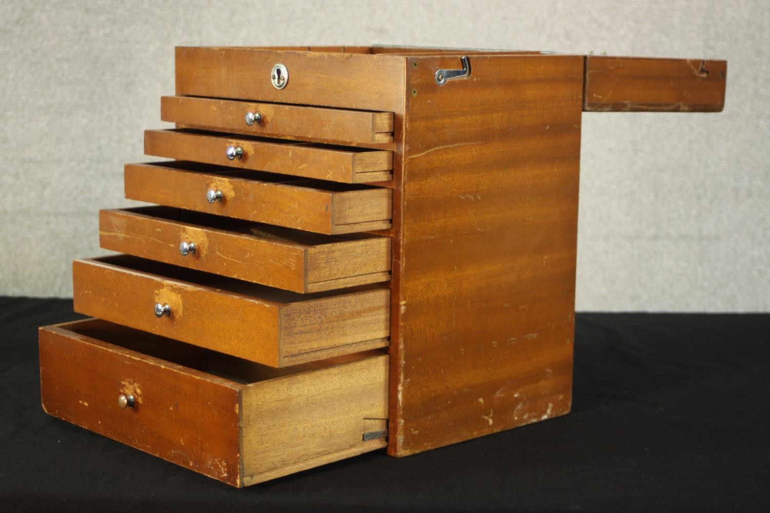 A mid 20th century teak collector's cabinet, with a foldover lid above six graduated fitted - Image 6 of 9