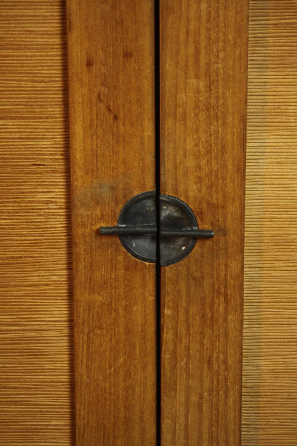 A contemporary hardwood two door floor standing cabinet, enclosing three shelves, on square - Image 5 of 8