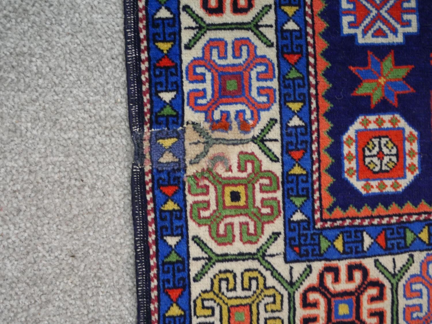 A blue ground hand made Russian Kazak rug. W.129 D.80cm - Image 4 of 6