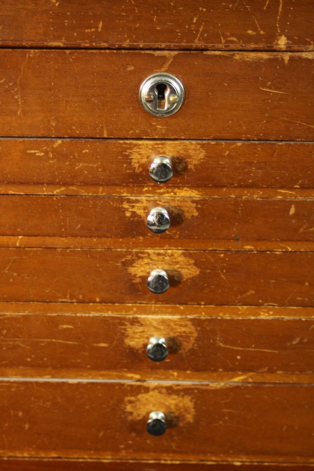 A mid 20th century teak collector's cabinet, with a foldover lid above six graduated fitted - Image 3 of 9