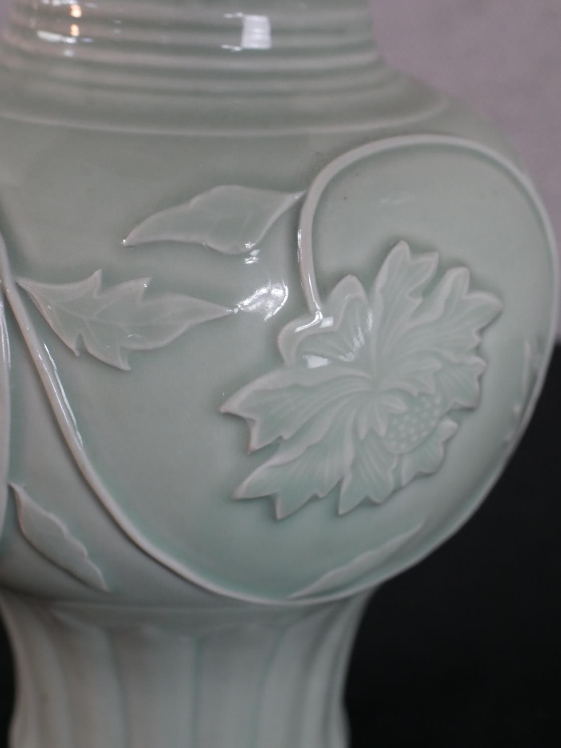 A Chinese celadon glazed porcelain vase, with a flared rim, a slender neck and a bulbous body, - Image 3 of 4