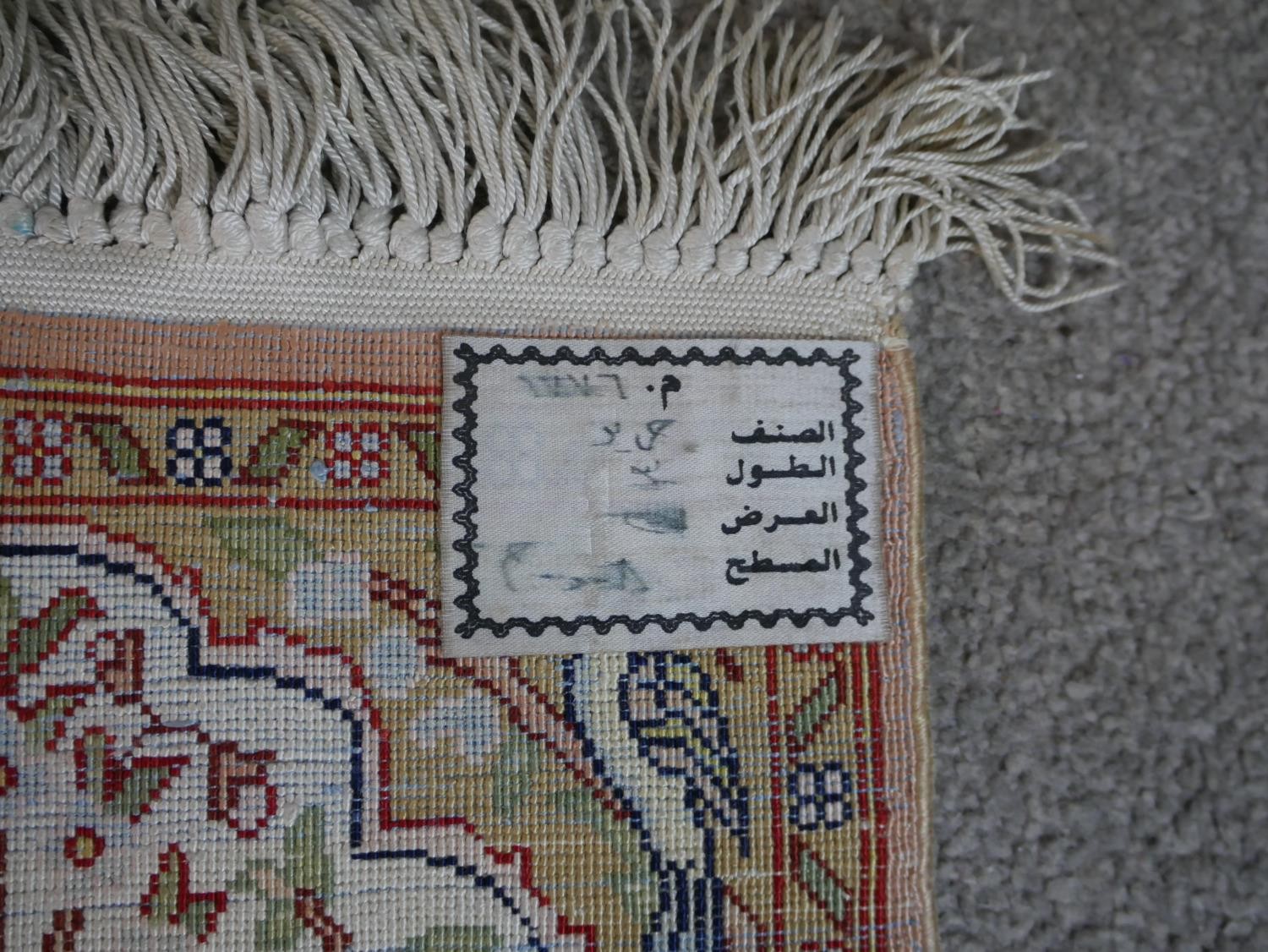 A cream ground hand made Persian silk Kum rug. W.33 D.28cm - Image 5 of 5