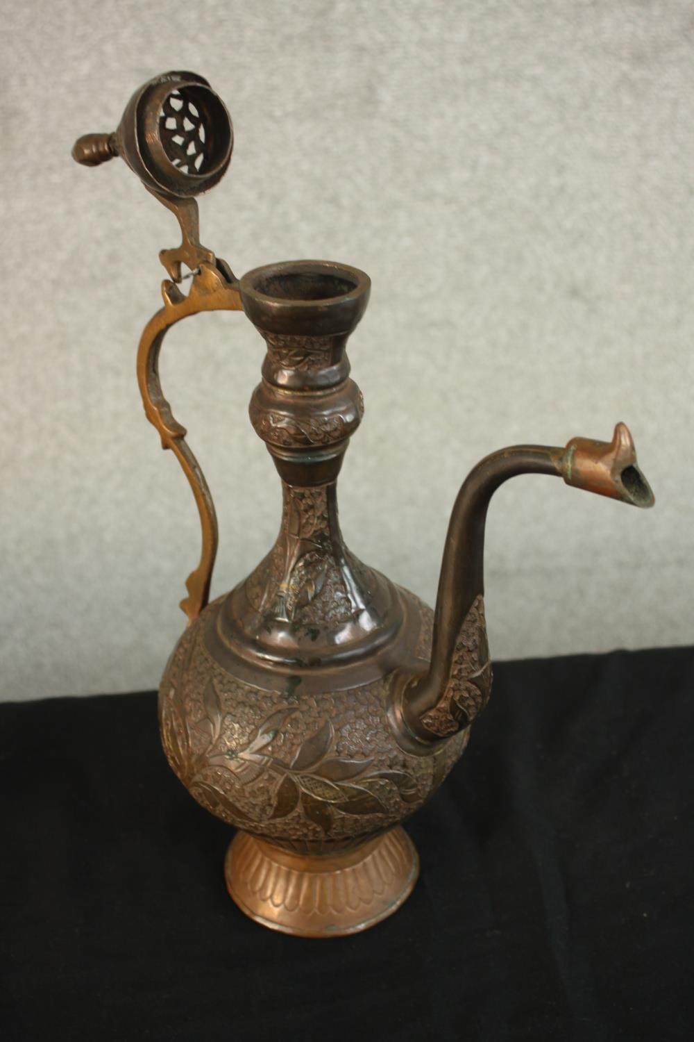 A Turkish engraved copper ewer decorated with a foliate design. H.37 W.24 D.13cm. - Image 9 of 12