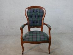 An early Victorian mahogany fauteil armchair with button back tartan fabric, with open