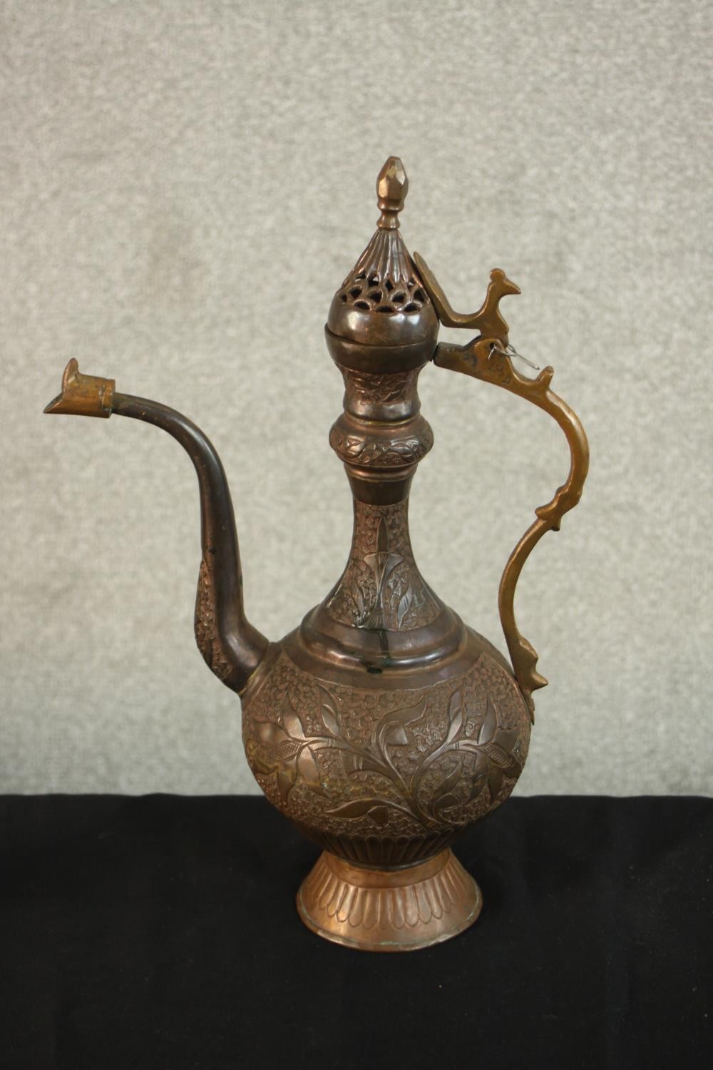 A Turkish engraved copper ewer decorated with a foliate design. H.37 W.24 D.13cm. - Image 3 of 12