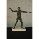 An ancient Greek style patinated spelter figure of Artemision on marble base. H.43 W.41 D.10cm.