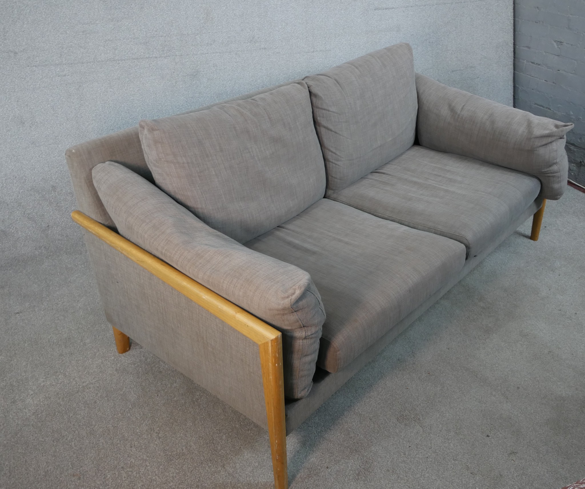 A John Lewis two seater sofa, upholstered in grey fabric, with oak arms and legs. H.77 W.192 D.88cm - Image 2 of 8