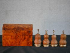 A Thuya wood jewellery chest along with four carved Peruvian gourds, each topped with a white