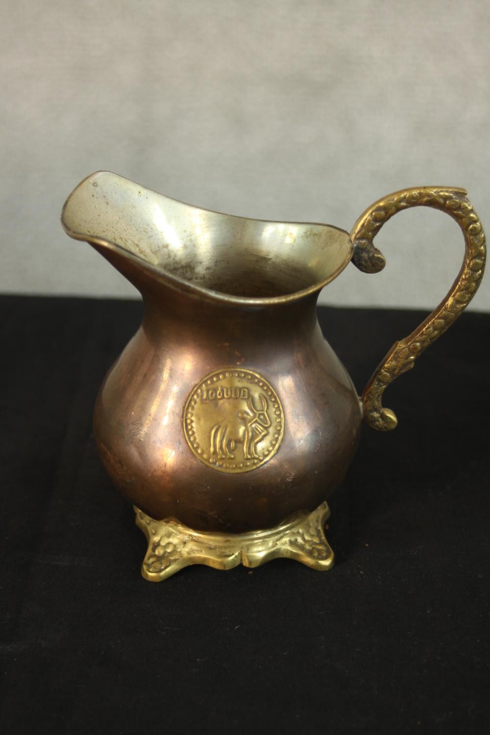 A three piece Indian brass and copper tea set with matching ashtray with relief lion boss detailing. - Image 3 of 12