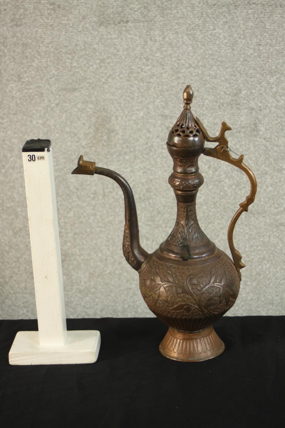 A Turkish engraved copper ewer decorated with a foliate design. H.37 W.24 D.13cm. - Image 2 of 12