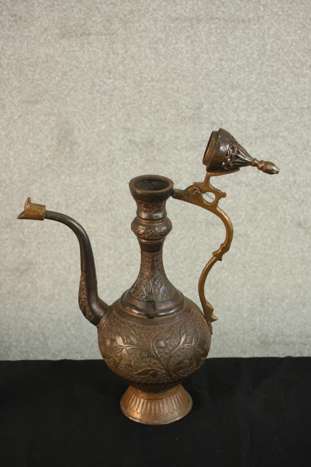 A Turkish engraved copper ewer decorated with a foliate design. H.37 W.24 D.13cm. - Image 4 of 12