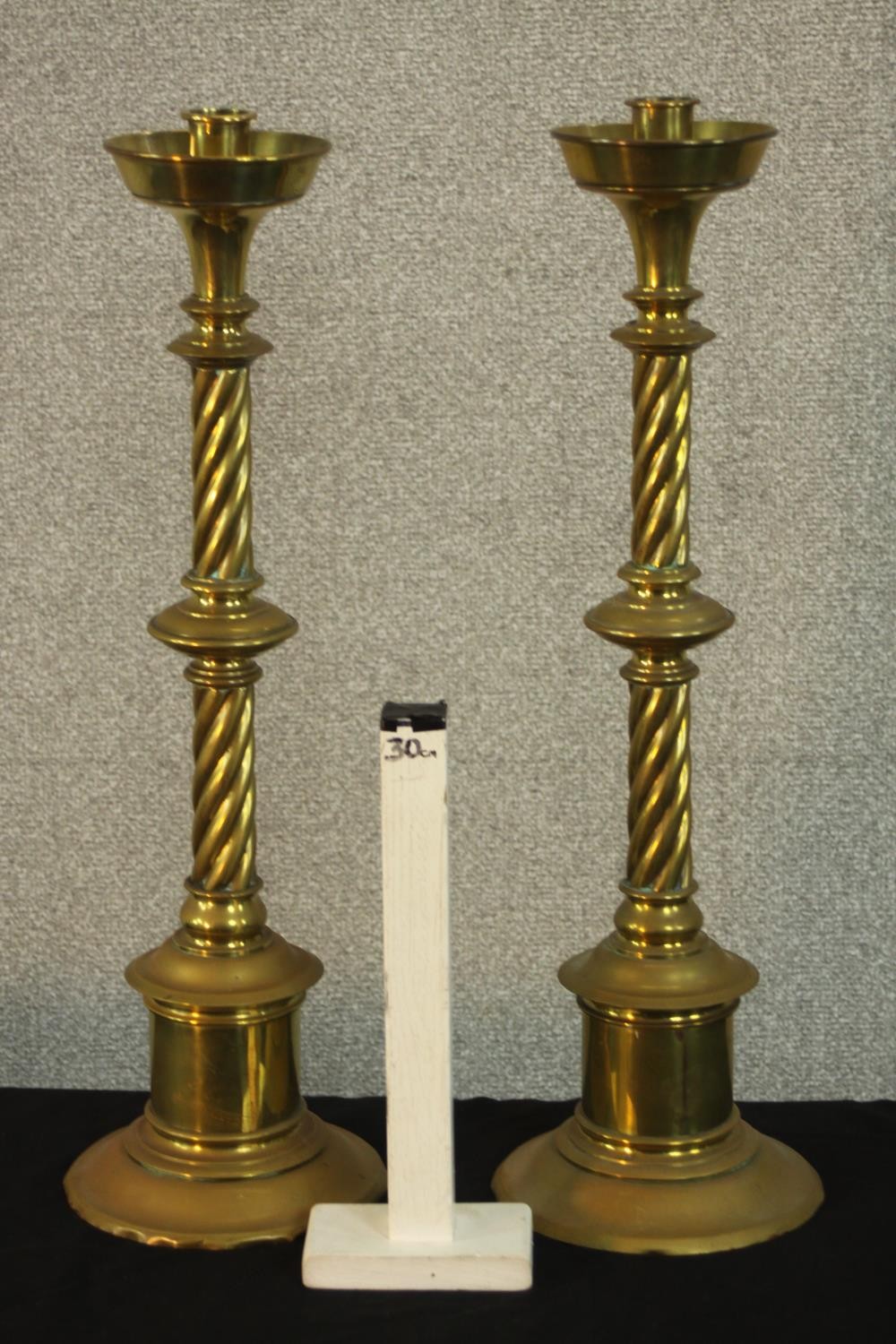 A pair of large early 20th century brass ecclesiastical twist stem floor standing candle holders - Image 2 of 5