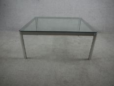 A late 20th century aluminium coffee table, of square form with canted corners with a plate glass