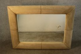 A contemporary rectangular mirror in a cream faux suede cushion frame. H.190 W.122cm