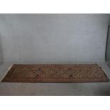 A biscuit ground hand made Erevan Russian runner. W.303 D.82cm