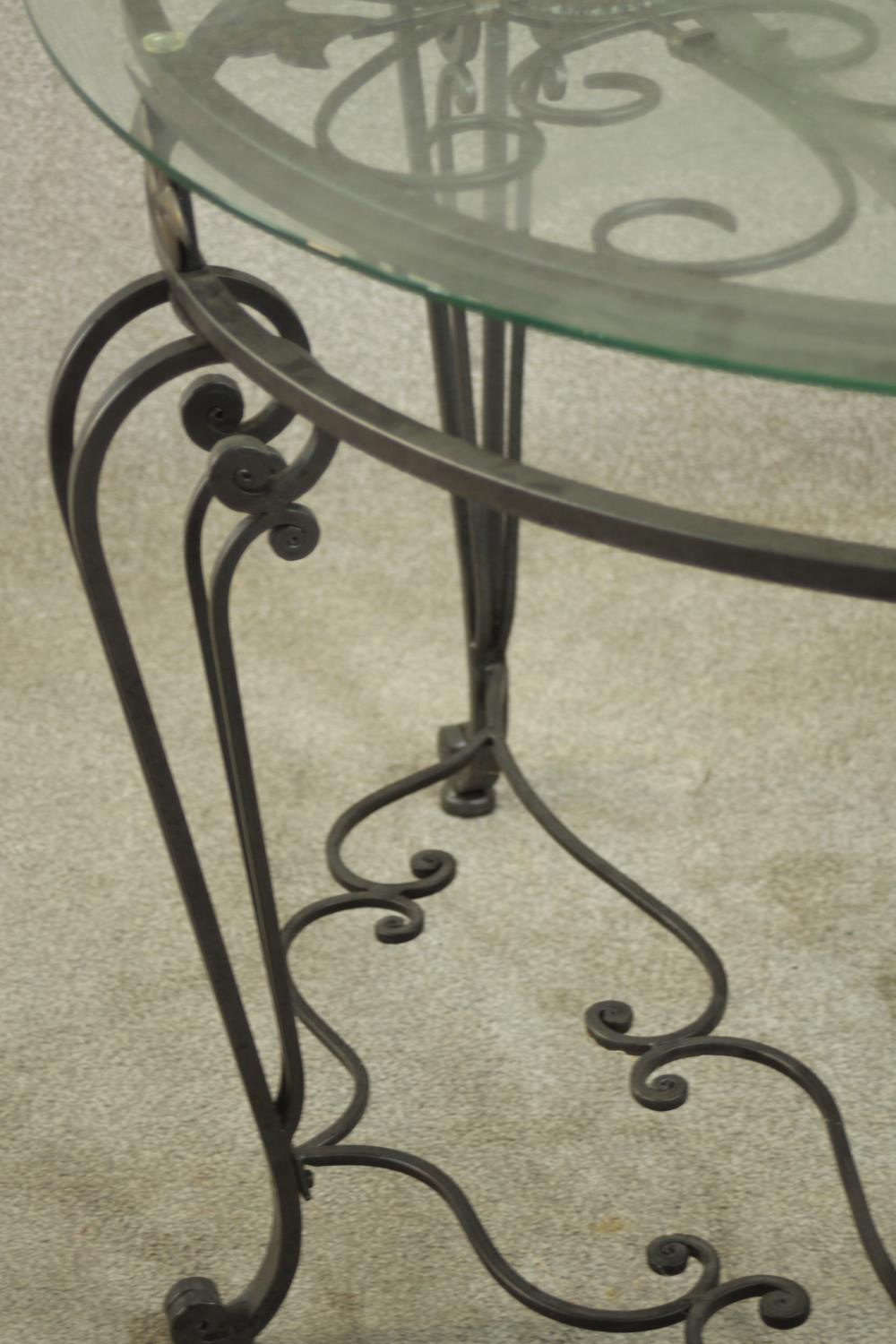 A contemporary wrought iron side table, of demi lune form with a plate glass top on three - Image 8 of 9