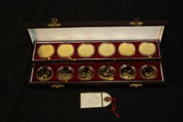 A boxed set of twelve Shenyang Mint proof official gilded Zodiac Medals, 1981 - 1992. H.3 W.28 D.