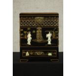 A contemporary Chinese black lacquered jewellery box, the exterior with figures carved from mother