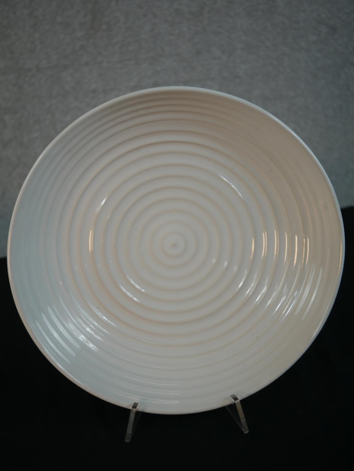 A white glazed bowl by Simon Moore, decorated with concentric circles. Diam.35cm