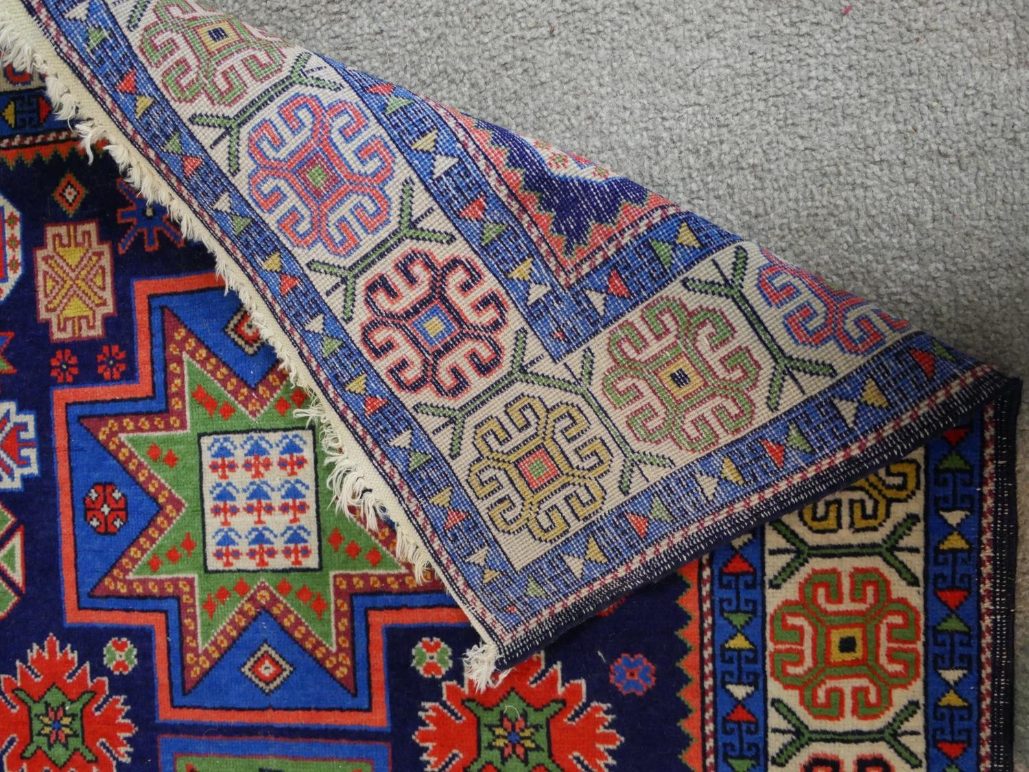 A blue ground hand made Russian Kazak rug. W.129 D.80cm - Image 5 of 6