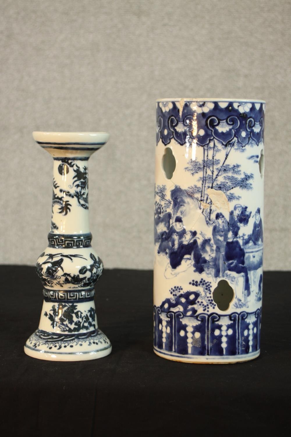 A Chinese blue and white porcelain candle holder painted with flying dragon and flaming pearl