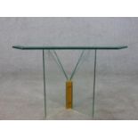 A contemporary occasional table, the square plate glass top with canted corners and a bevelled