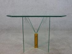 A contemporary occasional table, the square plate glass top with canted corners and a bevelled