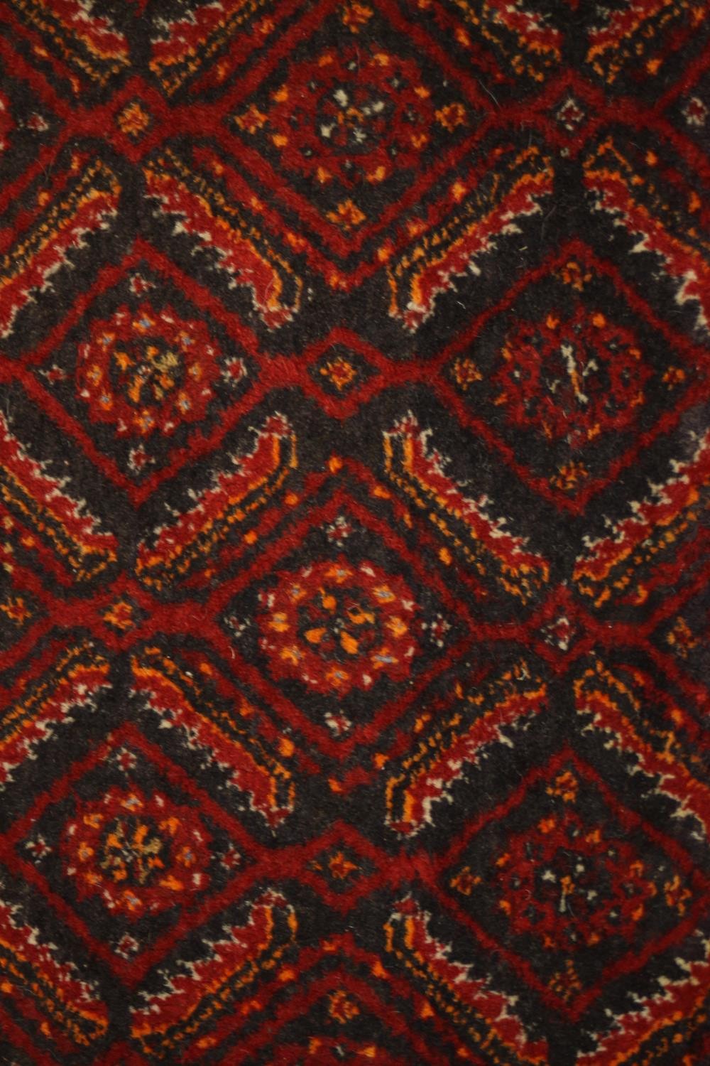 A red ground Baluch rug with all over geometric pattern. L.190 W.88cm. - Image 6 of 6