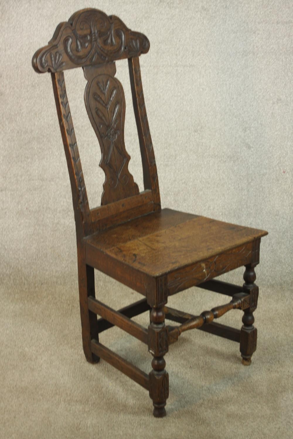 A 19th / early 20th century carved oak hall chair, with carved rail and splat back raised on - Image 2 of 6