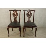 A pair of 19th/early 20th century mahogany single chairs each with carved rail, pierced splat