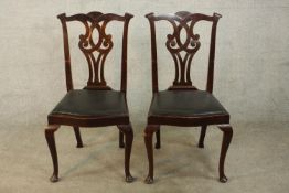 A pair of 19th/early 20th century mahogany single chairs each with carved rail, pierced splat