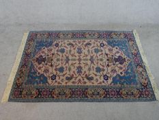 A beige ground hand made Russian Shirvan rug. W.178 D.117.5cm