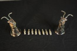 Two silver plated goat head hunting cups along with eight silver plated duck menu holders. H.12.5