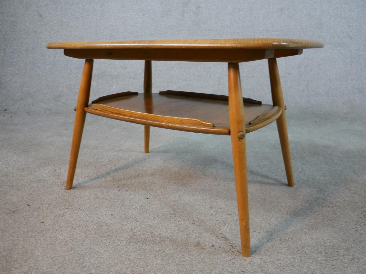 A 20th century blonde elm and beech Ercol two tier occasional tray table, model number 457, raised - Image 4 of 5