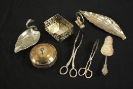 A collection of mixed silver plate, including a silver plate leaf dish, tongs, cake slice and lidded