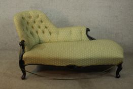 A Victorian style mahogany framed chaise longue, with recently upholstered button back and raised on