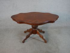 A mid to late 20th century Italian Sorrento marquetry inlaid centre table, the top of cartouche form