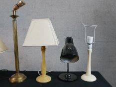 Four assorted decorative table lamps to include a fluted brass lamp raised on domed foot.