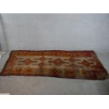 A beige ground handmade Persian Hamadan carpet. W.290 D.117cm