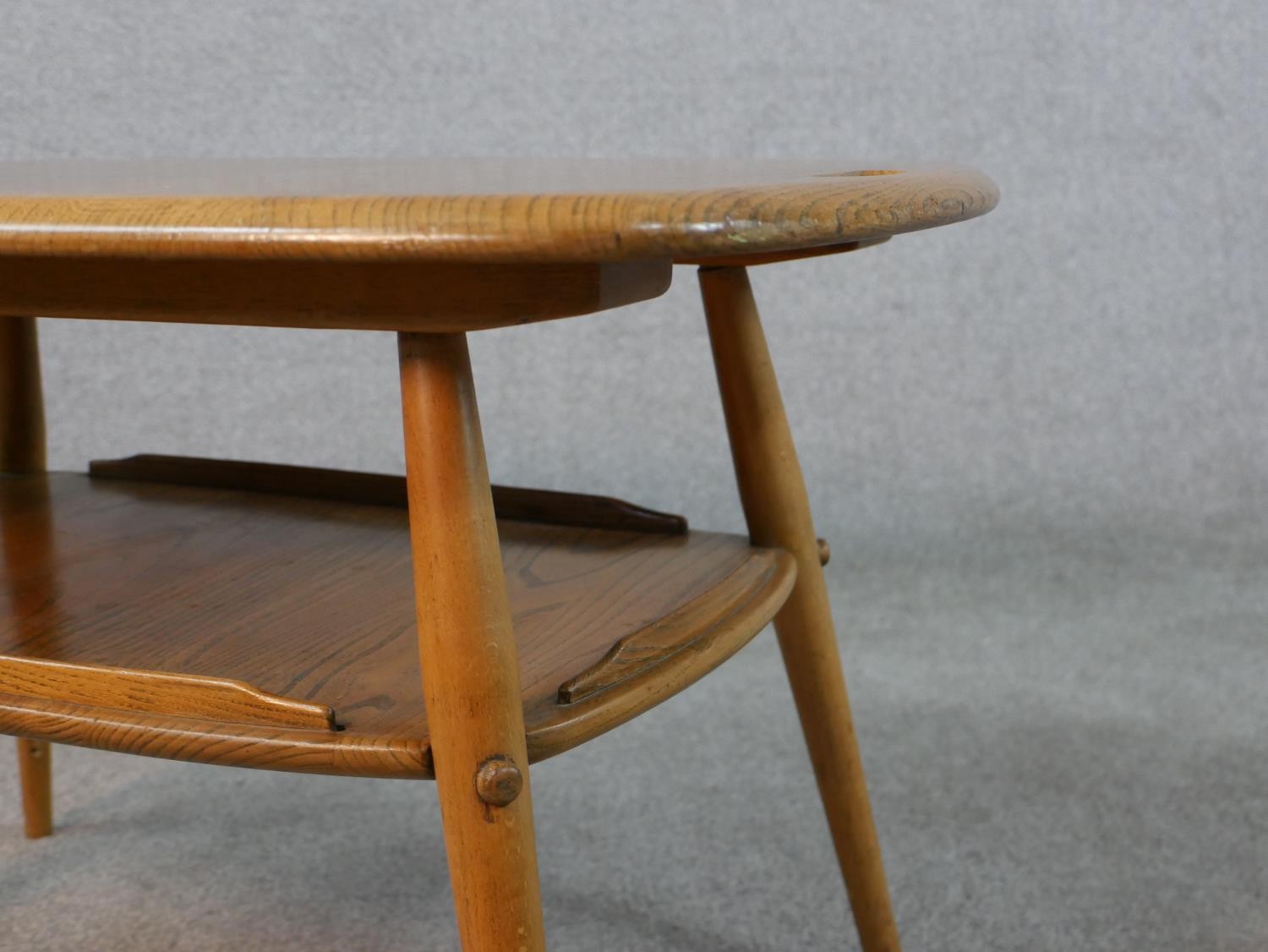 A 20th century blonde elm and beech Ercol two tier occasional tray table, model number 457, raised - Image 5 of 5