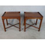 A pair of reporoduction mahogany lamp tables in Chippendale style, of rectangular form with a