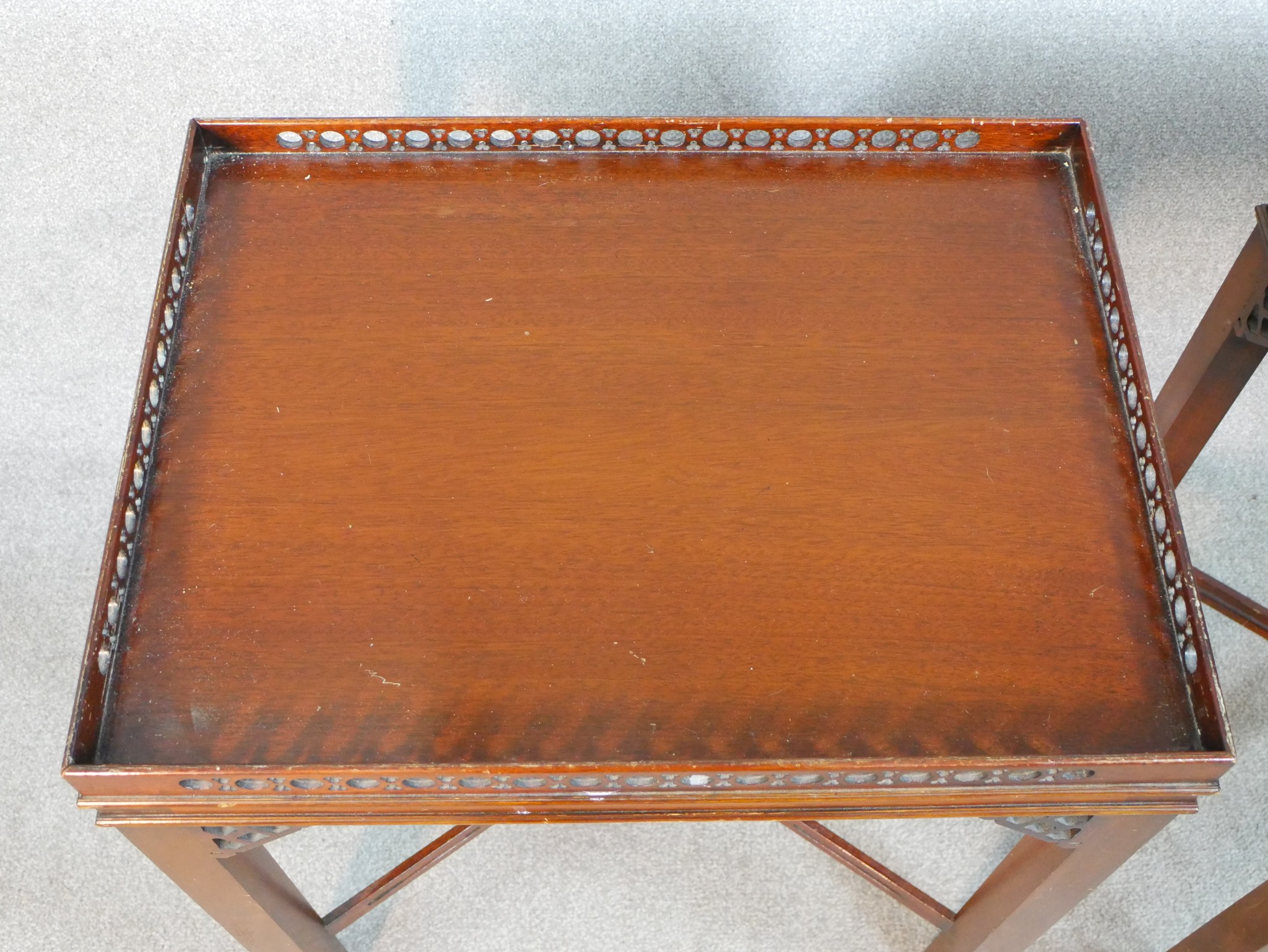 A pair of reporoduction mahogany lamp tables in Chippendale style, of rectangular form with a - Image 2 of 7