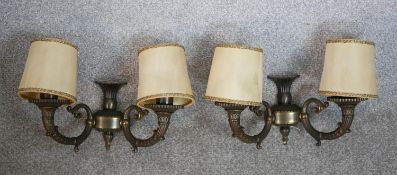 A pair of 20th century Renaissance revival wall sconces, each with twin cornucopia form branches and